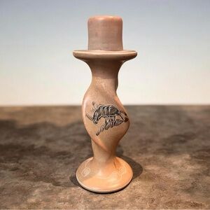 hand-carved African soapstone candle holder. stylized wildlife designs.